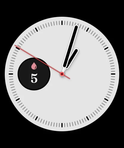An analogue watch face with BloomBook’s circular feed-count complication.